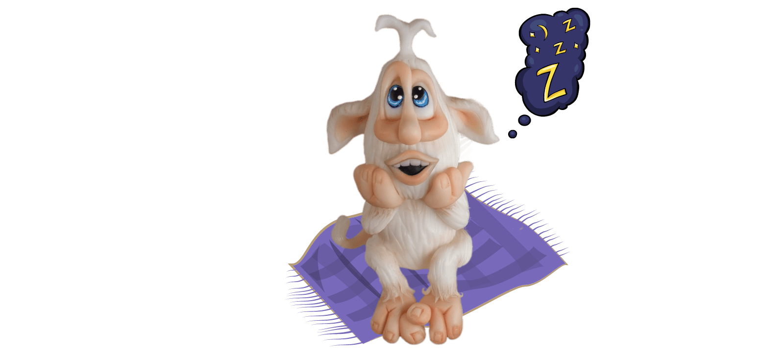 A cartoon creature with large ears and blue eyes sits on a blanket, daydreaming about sleep with "Z" symbols in a thought bubble. Perfect as a Booba-inspired fondant cake topper!