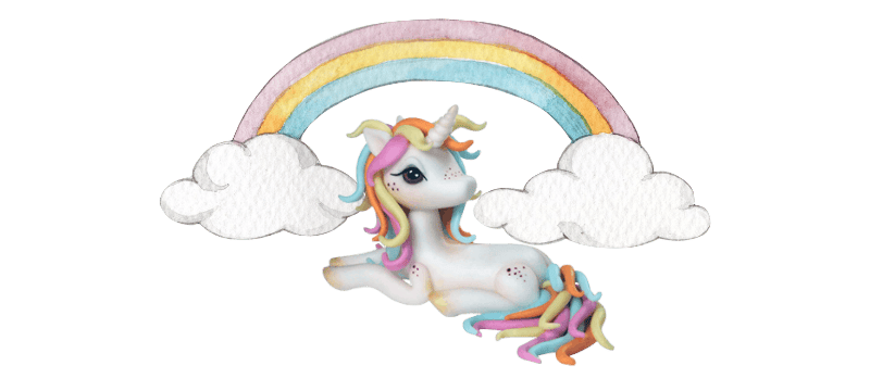 A whimsical unicorn with a rainbow-colored mane lounges under a pastel rainbow with fluffy white clouds on either side, all crafted as an enchanting fondant cake topper.