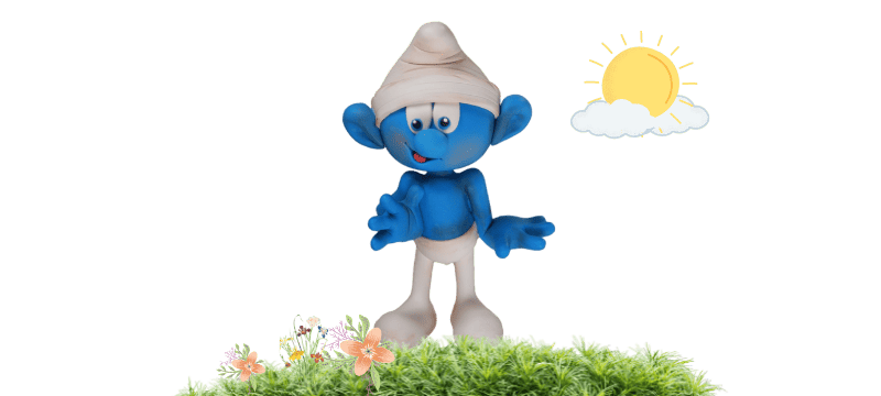 A blue animated character, reminiscent of a Smurf and wrapped in a bandage, stands on grass with flowers. The sun and a cloud decorate the sky above, making it look like an idyllic Fondant Cake Topper scene.