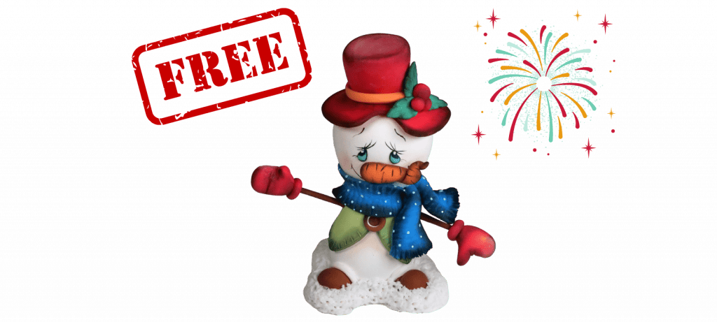 A snowman figurine with a red hat and blue scarf stands beside a colorful firework, while a red "FREE" stamp in the top left corner offers a Free Video Tutorial on creating this adorable Fondant Cake Topper.