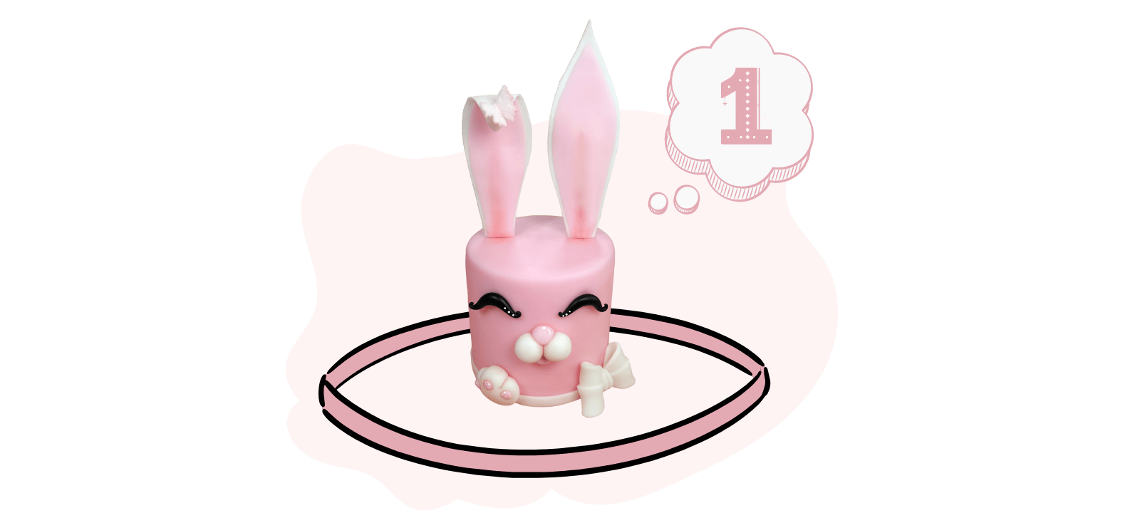 Pink cake decorated with bunny ears, eyes, and a nose, surrounded by candy. Number "1" inside a thought bubble. Ideal for showcasing your fondant cake decoration skills or following along with a video tutorial.